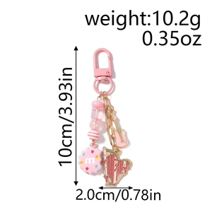 Detail view of pink guitar and harp keychain with dimensions 10cm by 2cm and weight 10.2g