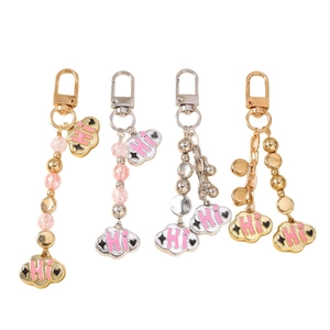 Cloud keychain pendants with pink Hi text and beaded charms in gold and silver finish