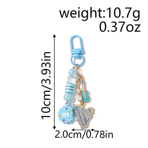 Detail view of light blue music keychain with guitar harp charms and beaded accents