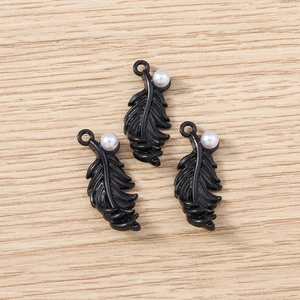 Three black feather charms with white imitation pearls for DIY jewelry making and crafts