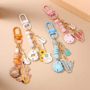Chic guitar and harp beaded keychains with biscuit pendants in four vibrant colors
