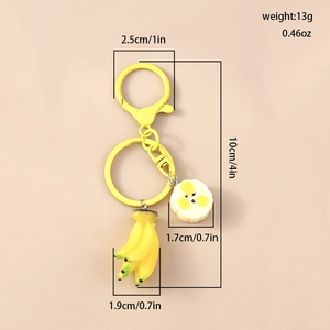 Detailed size specifications for the yellow banana keychain showing 10cm total length