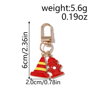 Detailed view of red hydrant and traffic cone metal keychain with dimension labels
