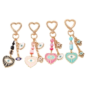 Colorful Evil Eye and Hamsa Hand keychains with golden heart-shaped lobster clasps
