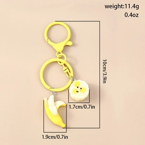 Macro view of banana charm keychain set with detailed dimensions and yellow resin finish