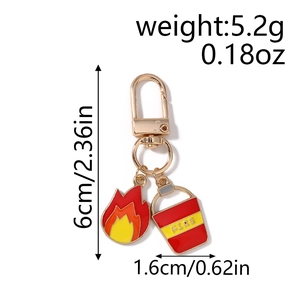 Detailed view of firefighting keychain with red enamel fire bucket and flame charms