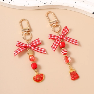 Chinese style red beaded keychain with ribbon bow and lucky enamel pendant charms