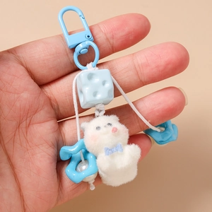 Cute plush cat keychain with blue bow and floral charm accessory for bags