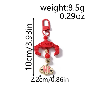 Detail view of red claw machine keychain with size measurements and Hi cloud pendant