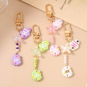Colorful starfish and cloud keychains with golden lobster clasps for bag charms