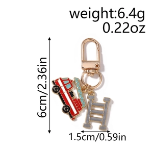 Detail view of firefighter keychain showing firetruck and ladder charms with dimensions