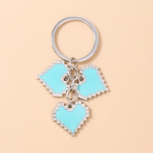 Detailed view of pixel art heart keychains in sky blue with silver metal chain