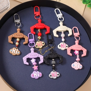 Colorful crane machine claw keychains with star beads and clouds in six vivid colors