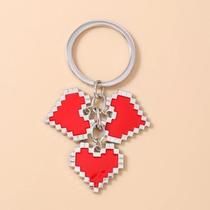 Detail of silver keychain featuring three retro red pixel heart enamel pendants