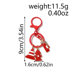 Detail view of firefighter keychain with hydrant, traffic cone, and size measurements