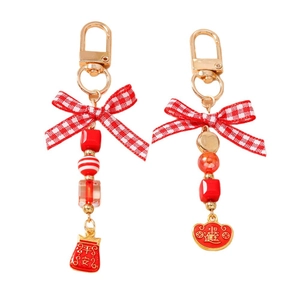 Fashionable beaded keychain with red bow and traditional Chinese blessing charms