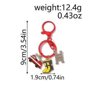 Detail view of red fire truck, yellow boots and ladder charms on a fire hydrant keychain