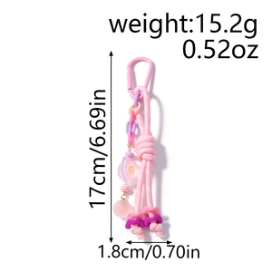 Vue détaillée du porte-clés tressé rose avec dimensions 17 cm de long et 1,8 cm de large