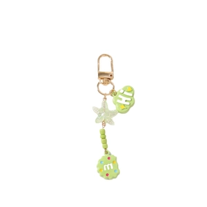 Green beaded keychain with starfish and cloud charms on a gold clip for bag decor