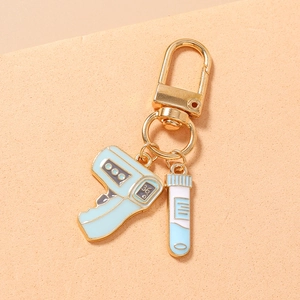 Detailed medical keychain with a blue thermometer and test tube on a gold lobster clasp