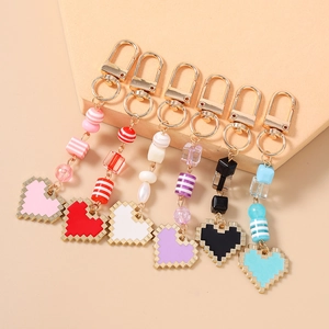 Colorful beaded pixel heart keychains with gold lobster clasps and mosaic heart charms