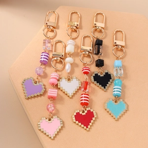Colorful 8-bit pixel heart keychains with gold metal clasps for bags and keys