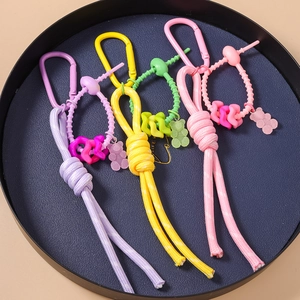 Breloques ours tressées à la main en nylon pour sacs en violet, jaune, vert et rose