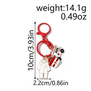 Detail view of medical keychain with nurse coat, ambulance and red medicine kit charms