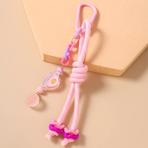 Porte-clés en corde tressée rose avec chaîne colorée et pendentif planète en acrylique