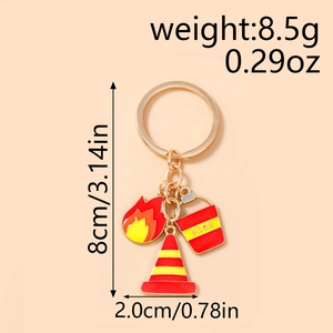 Detailed view of firefighter keychain with red fire bucket and orange traffic cone charms
