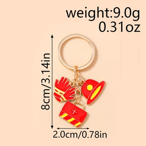Zinc alloy fire theme keychain featuring red helmet, glove and kit charms in gold finish