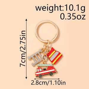 Detail view of firefighter keychain with red fire truck and vest enamel charms