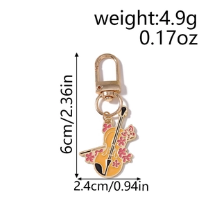 Vue détaillée du porte-clés violon jaune avec émail floral et dimensions indiquées