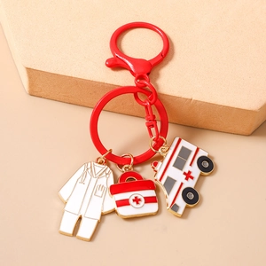 Detailed view of nurse theme keychain with doctor uniform, first aid kit and ambulance charms