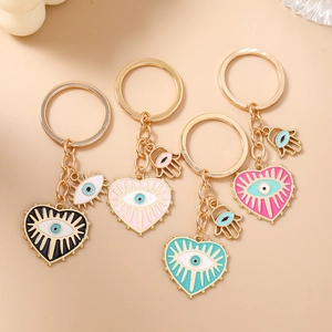 Porte-clés cœur mauvais œil à la mode avec breloques hamsa en quatre couleurs vives