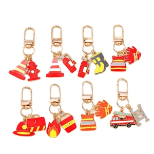Firefighter keychain set with gold D-rings featuring mini fire truck and extinguisher charms