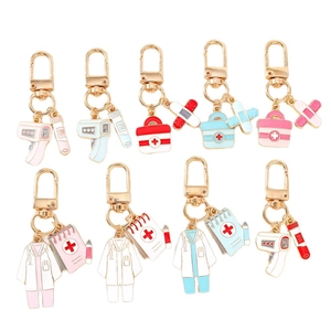Medical themed enamel keychains set with thermometer and first aid kit charms