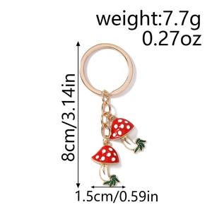 Detail view of mushroom keychain showing 8cm length and 7.7g weight dimensions