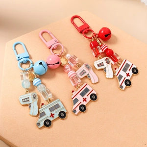 Medical theme metal keychain with bell, ambulance and thermometer pendants in three colors