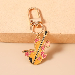 Porte-clés violon exquis en alliage doré avec motif de fleurs de cerisier en émail rose