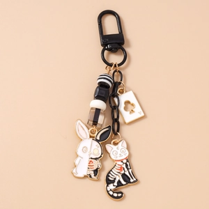 Detail of cartoon rabbit and cat keychain with poker card pendant and acrylic beads