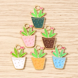 Colorful enamel cactus alloy charms in six colors for DIY jewelry making on wood background