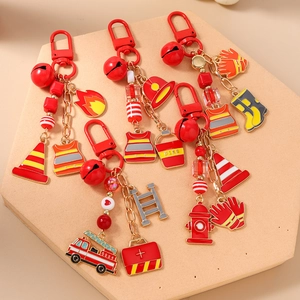 Firefighter themed keychain set with red charms including fire truck and hydrant