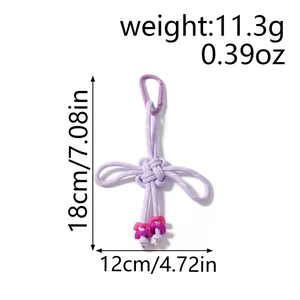 Detail view of purple handmade Chinese knot keychain with dimensions and weight info