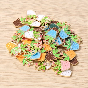 Macro detail of assorted enamel succulent plant charms with colorful pots for DIY jewelry
