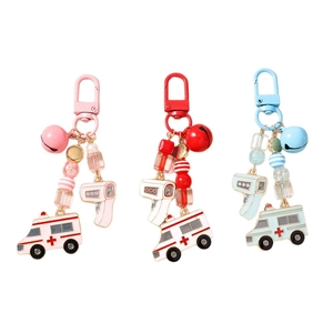 Beaded medical theme keychain set featuring ambulance and thermometer charms with colorful bells