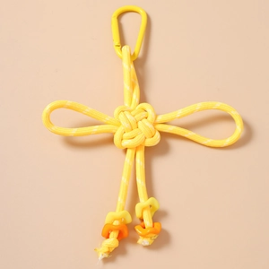 Detail of yellow paracord woven keychain with star charms and metal D-ring buckle