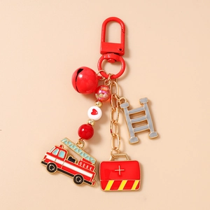 Detailed firefighter keychain with red fire truck, ladder, medical kit and bell accents