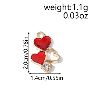 Detail of red enamel heart charms with gold cutout and zircon for DIY jewelry making