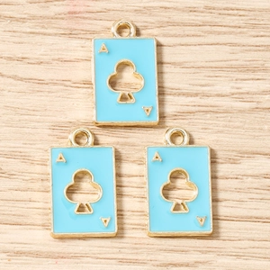 Detail of three sky blue enamel Ace of Clubs poker charms with gold metal plating for DIY